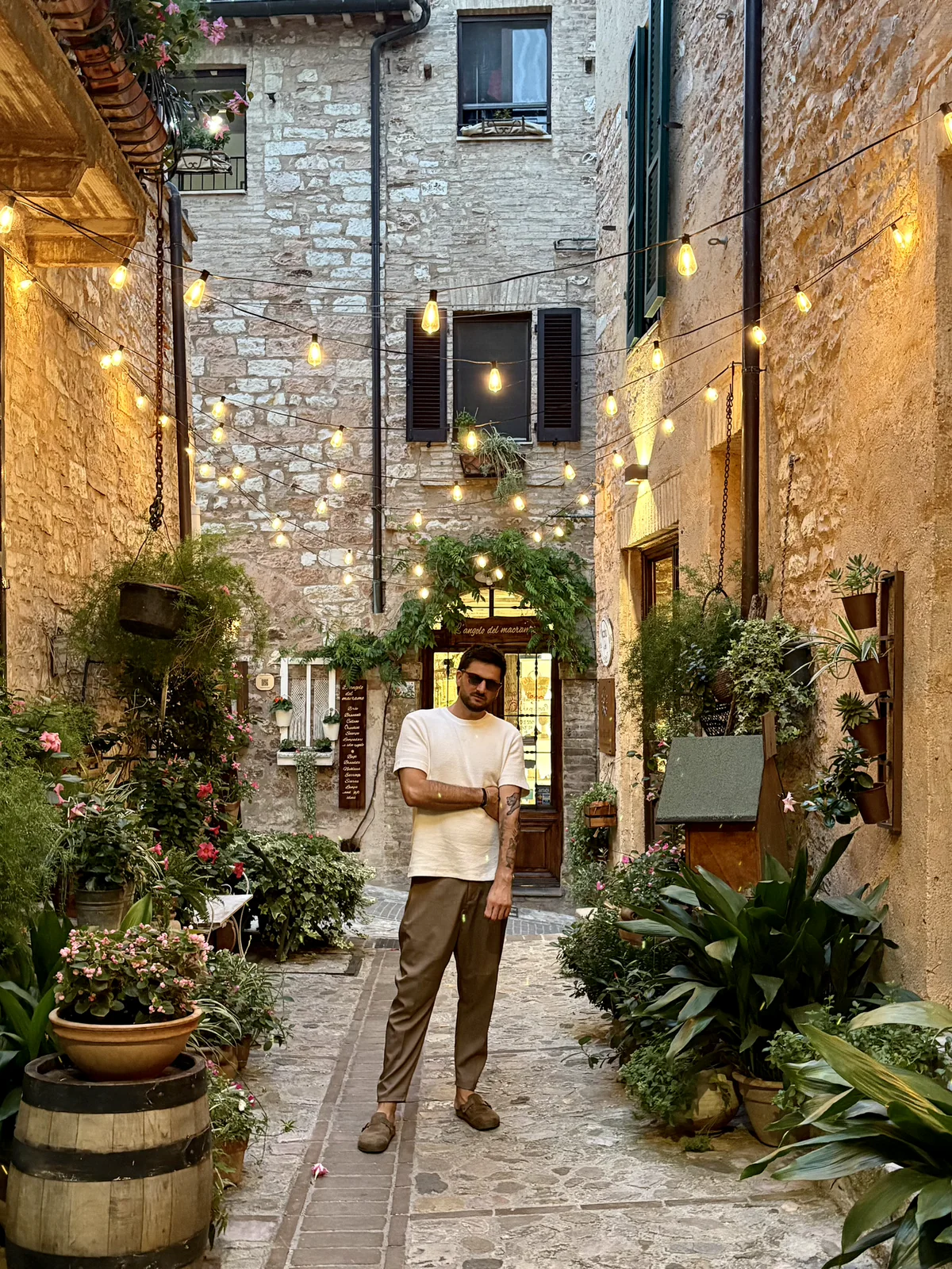 Daniele Antoniol in a flower-lined Italian village street