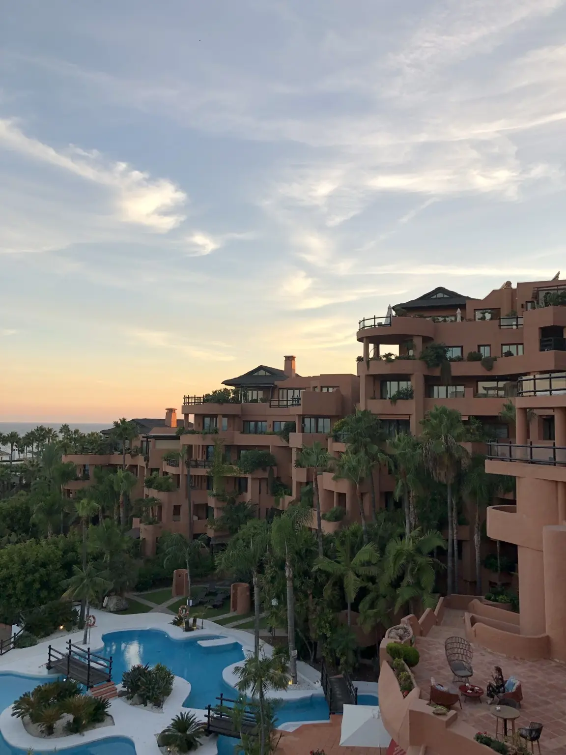 Kempinski Hotel Bahía in Estepona with pools and Mediterranean views at sunset