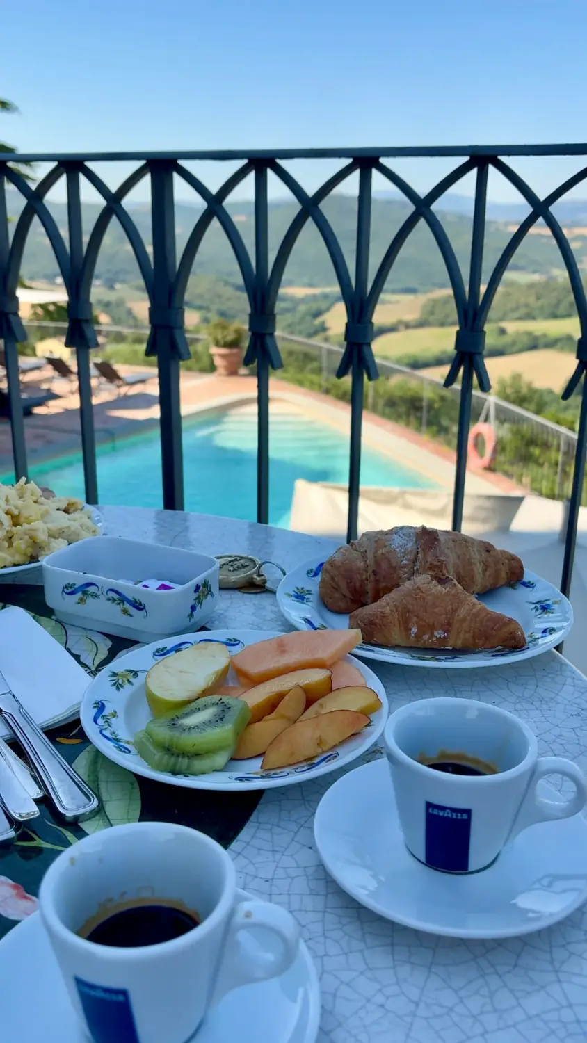 Breakfast overlooking the pool and Umbrian hills at Il Canalicchio
