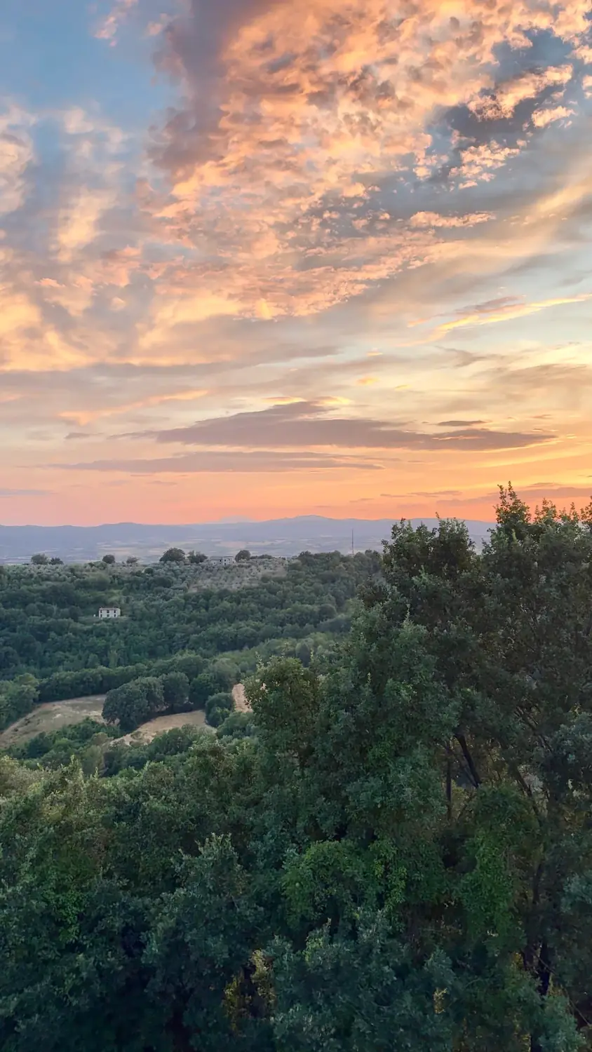 Sunset over wooded hills from Il Canalicchio