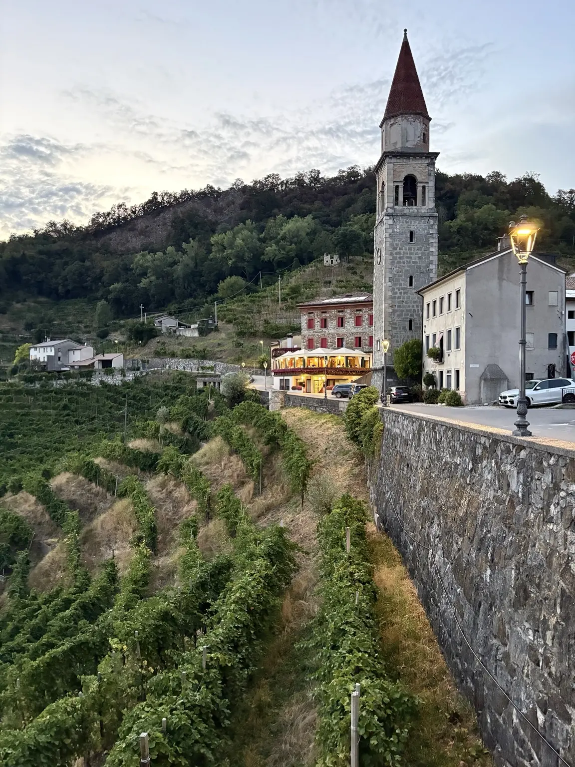 Bell tower, village and vineyards in the Prosecco Hills