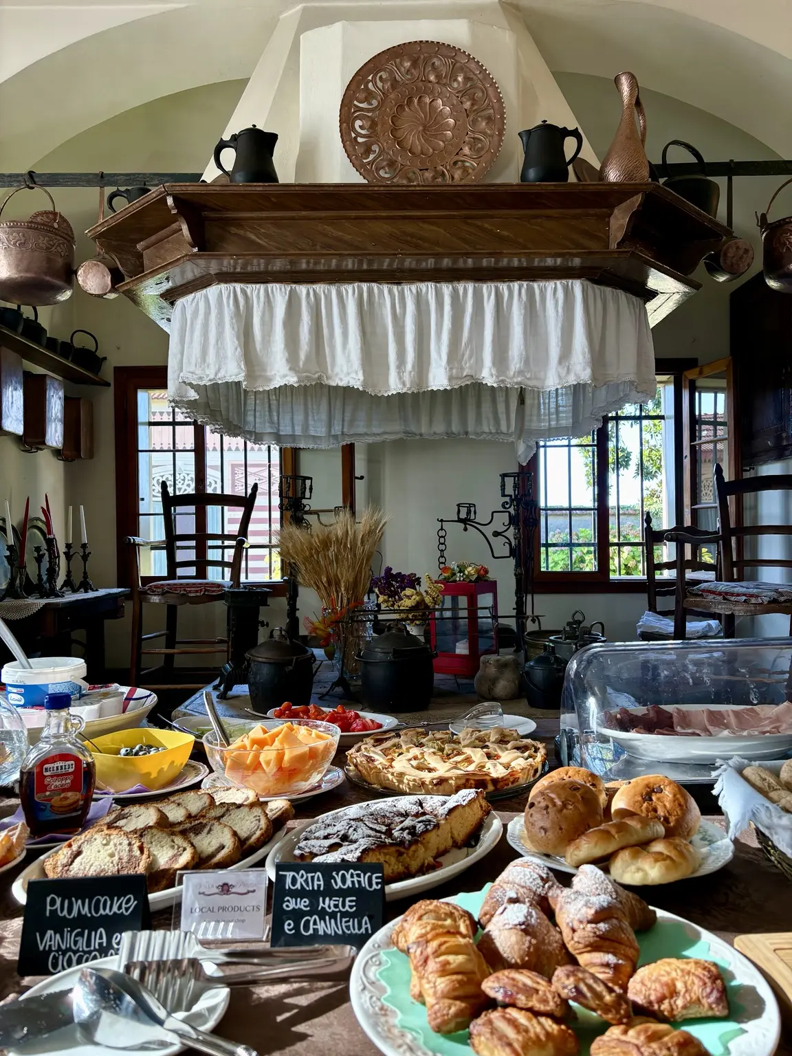 Breakfast buffet in a historic room at Villa Panigai